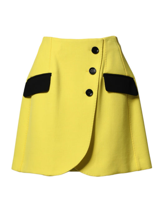 Yellow pleated skirt with black buttons and trim