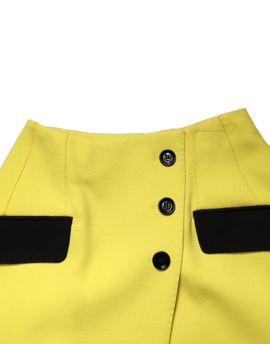 Yellow shorts with black buttons and stripes on sides