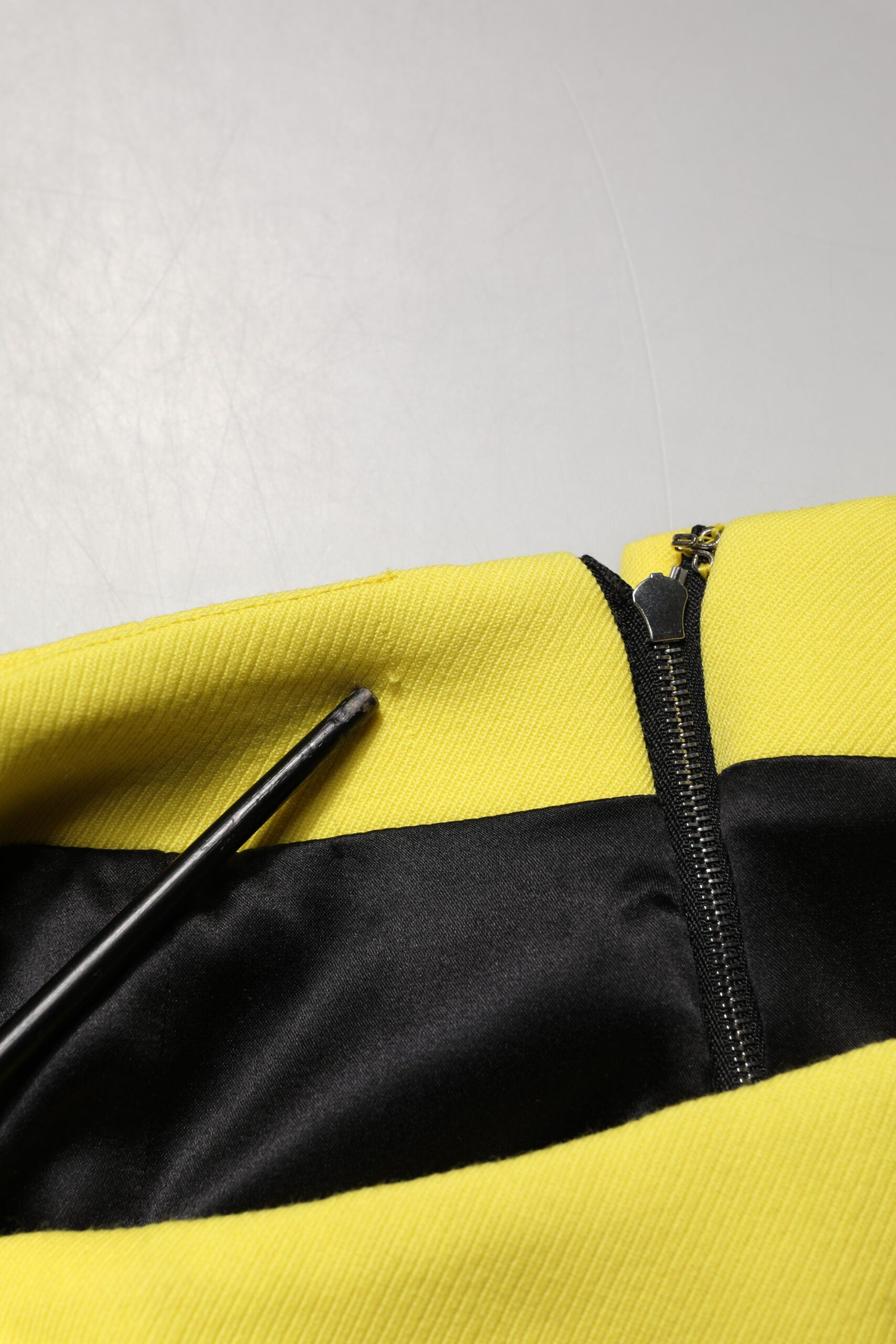 Yellow jacket with black zipper