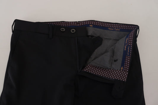 A pair of black tapered dress pants with a button and zipper closure