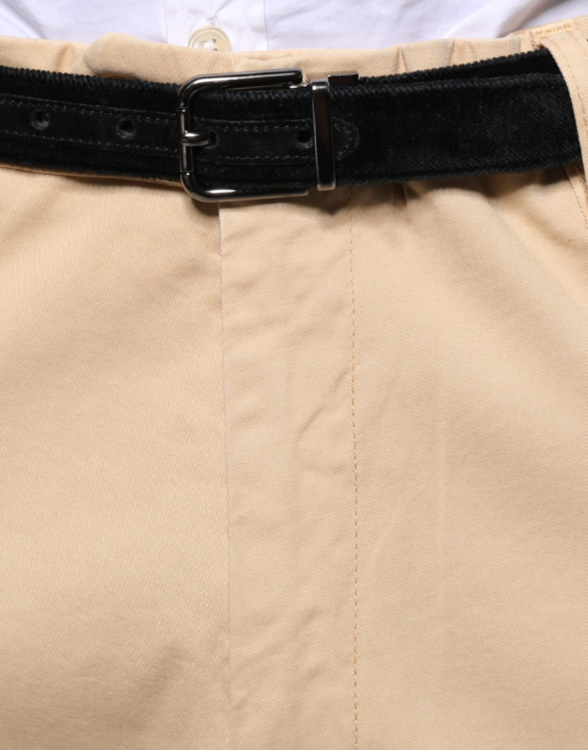 Tan cropped dress pants with belt loops, pockets and a zipper fly
