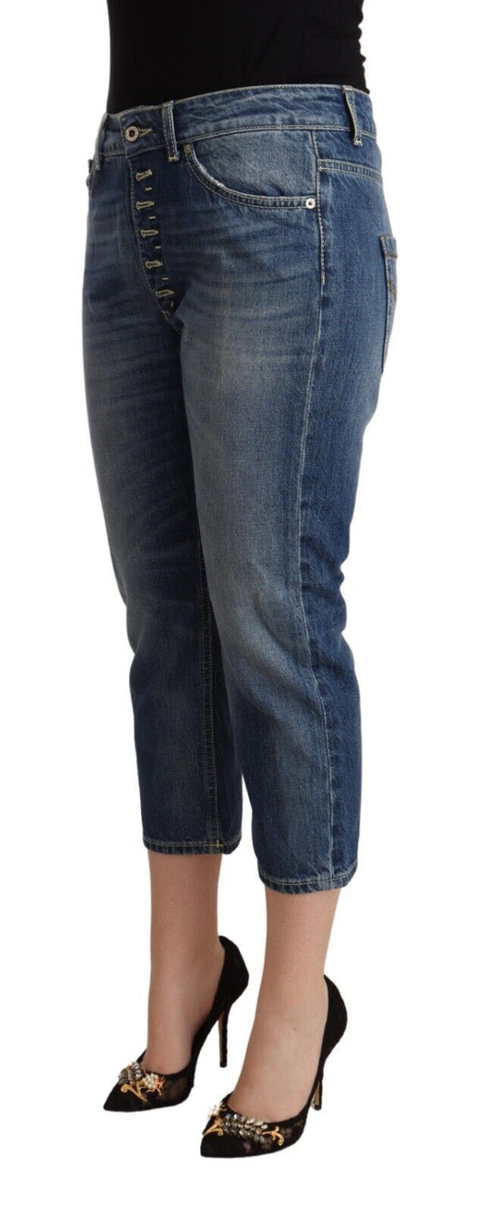 Woman wearing blue jeans and black heels
