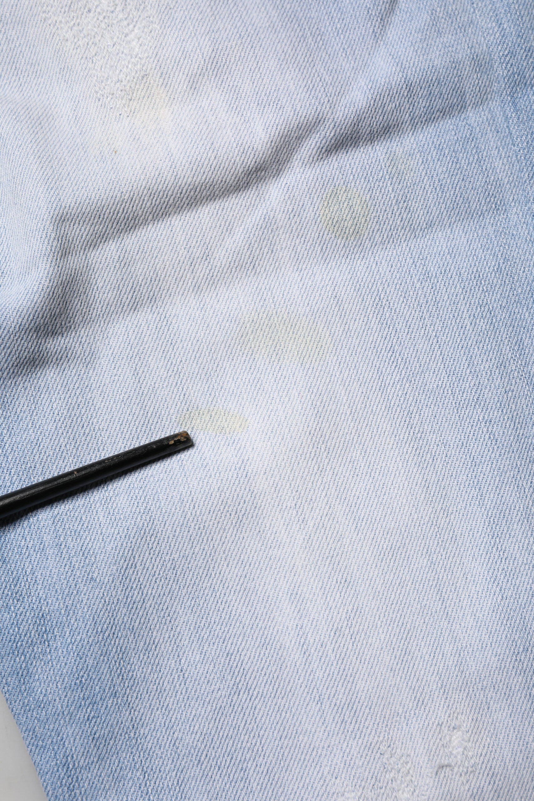 Blue denim fabric with visible stitching