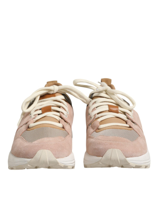 Pair of pink sneakers with white laces
