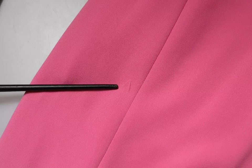 A pink viscose sheath dress with short sleeves and a backless design