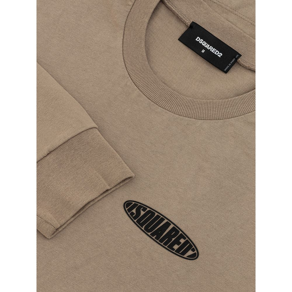 Tan sweater with black label on front