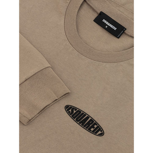 Tan sweater with black label on front