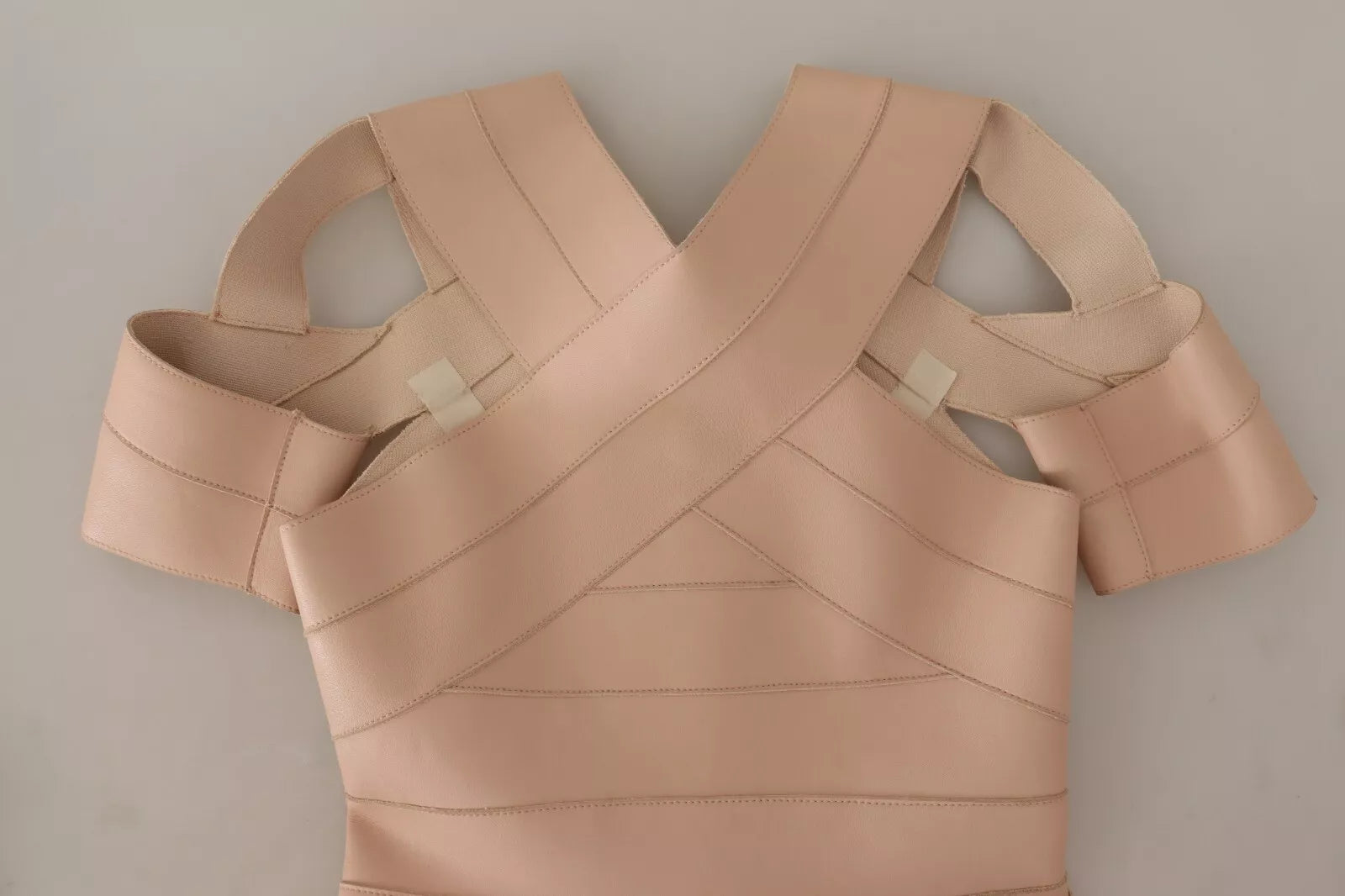 Pink leather shoulder dress with open back design