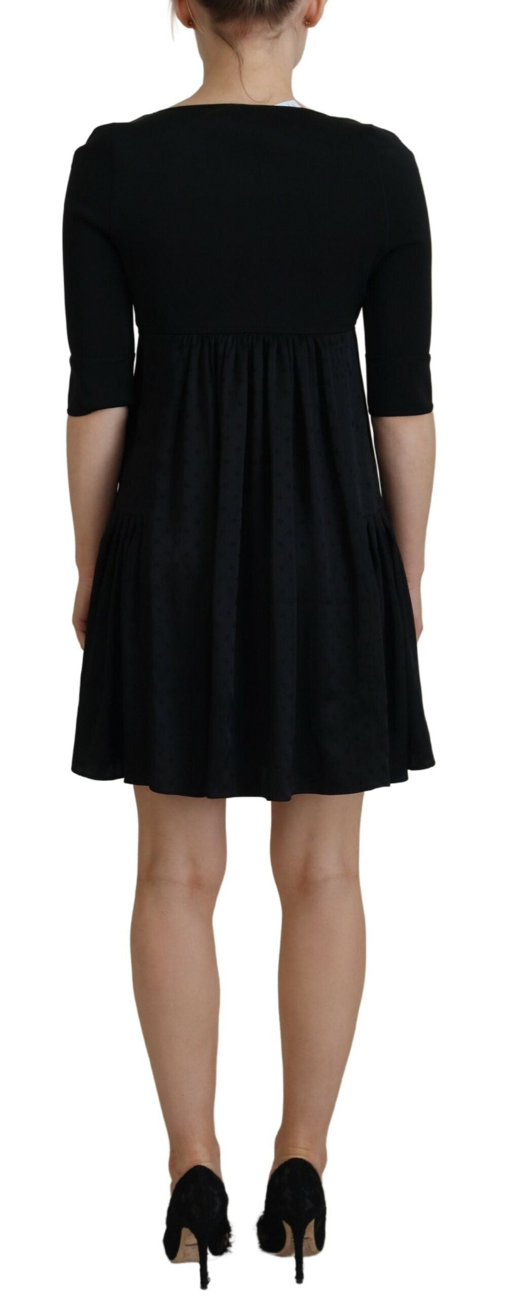 A black acetate short sleeve A-line sheath dress