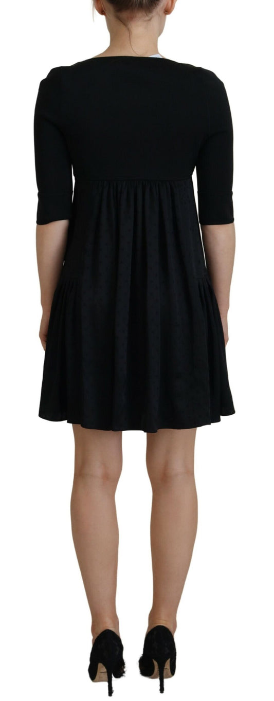 A black acetate short sleeve A-line sheath dress