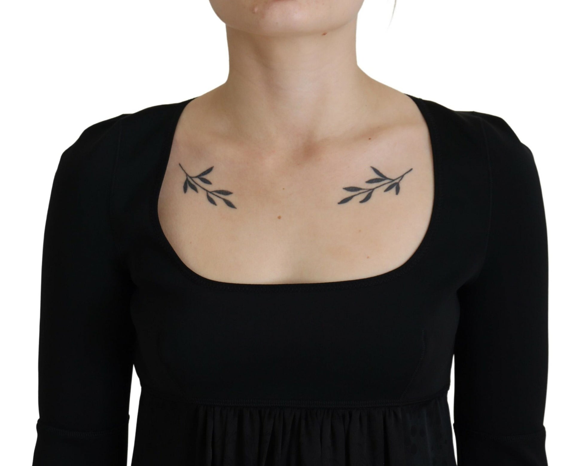 A black acetate short sleeve dress with a V-neckline