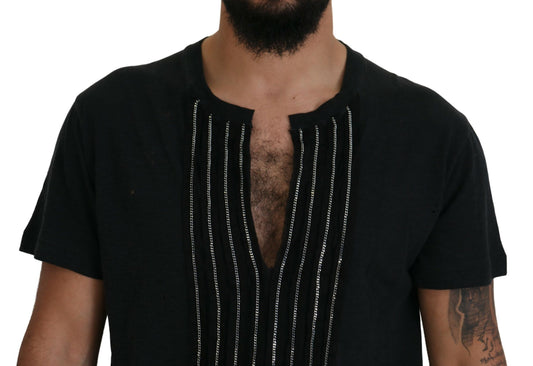 Man wearing black shirt with embroidered design on chest
