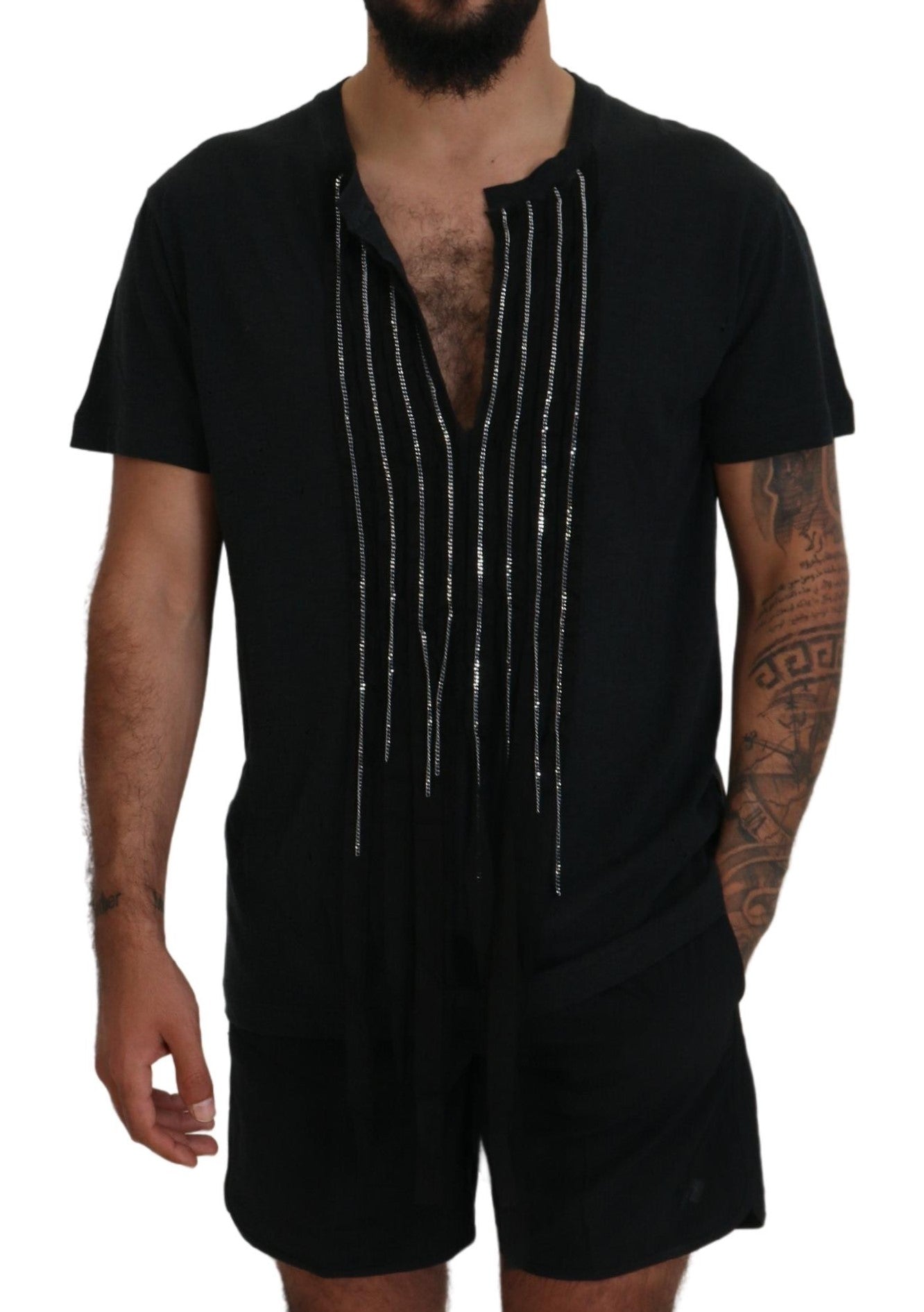 Man wearing black shorts with white embroidery