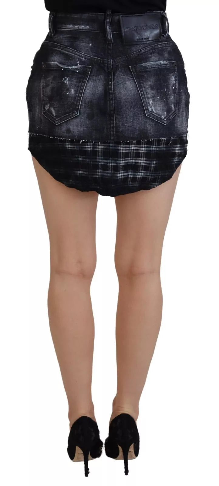 Woman wearing a denim skirt and black heels