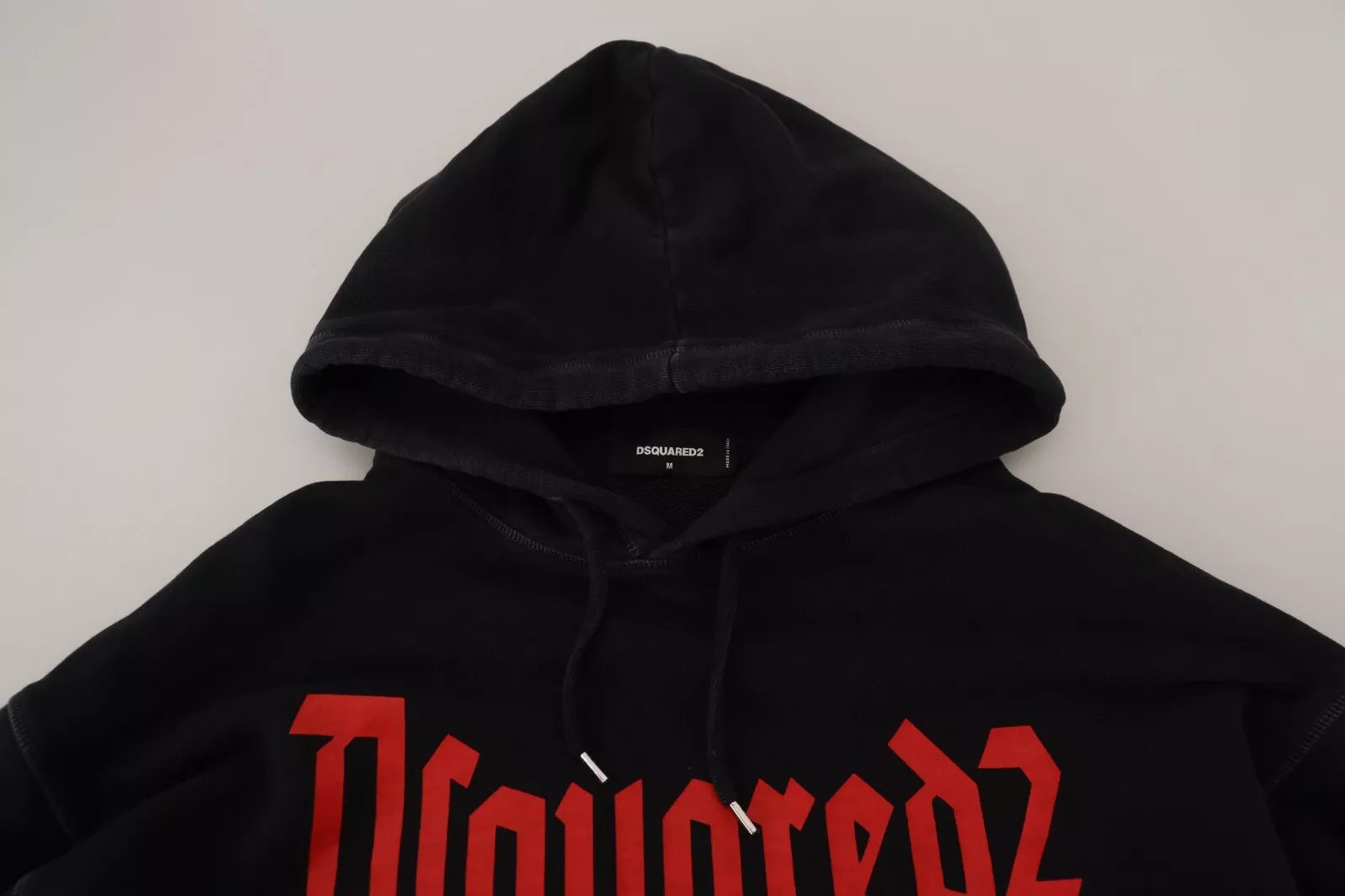 Black hoodie with red lettering on front