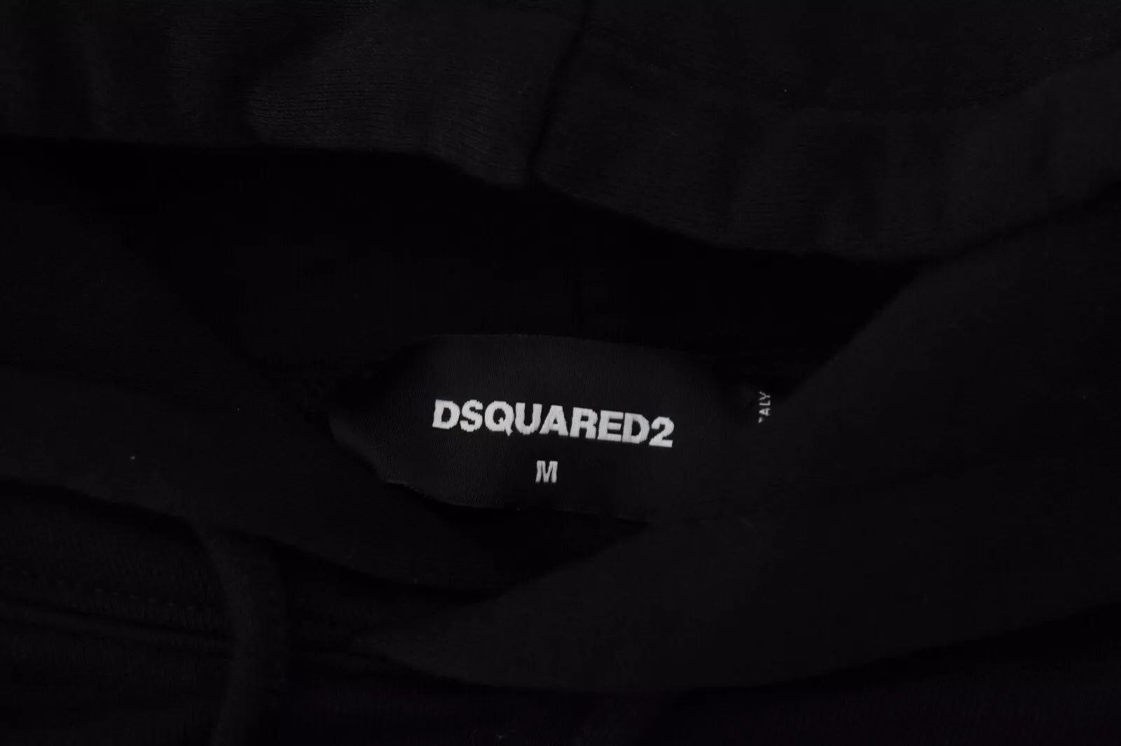 Black fabric with white lettering on it