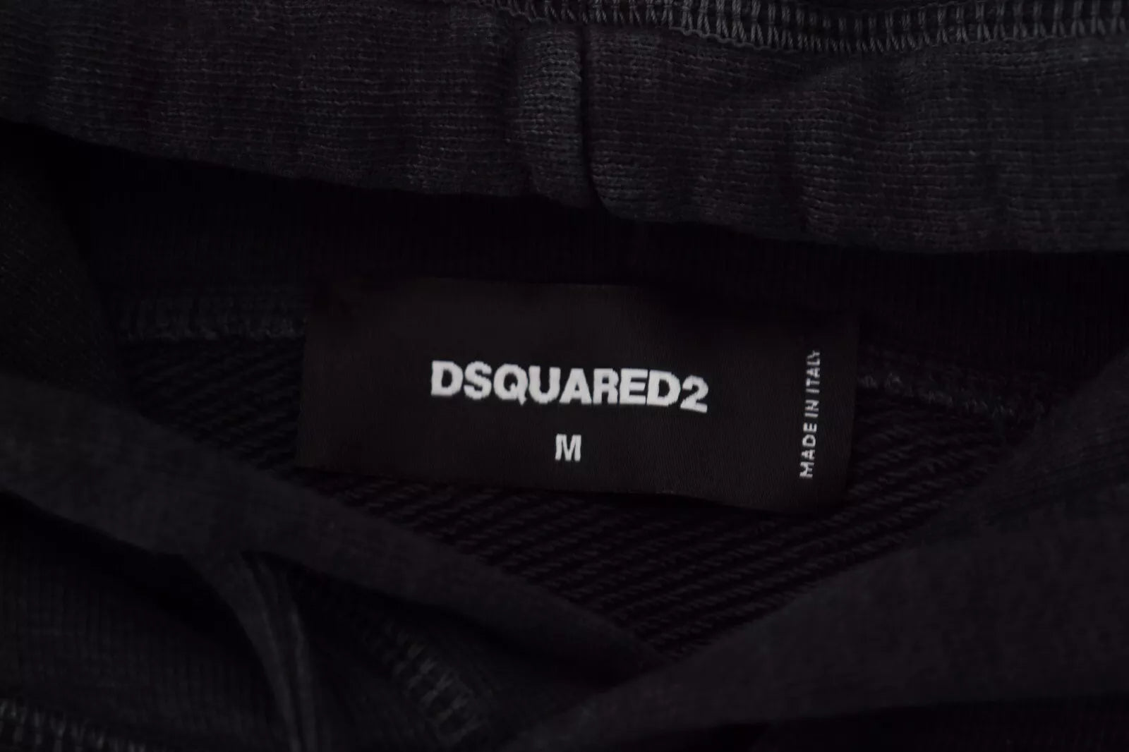 Black fabric with white label reading "DSQUARED2