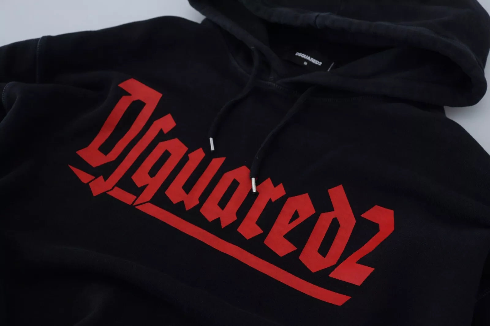 Black hoodie with red lettering