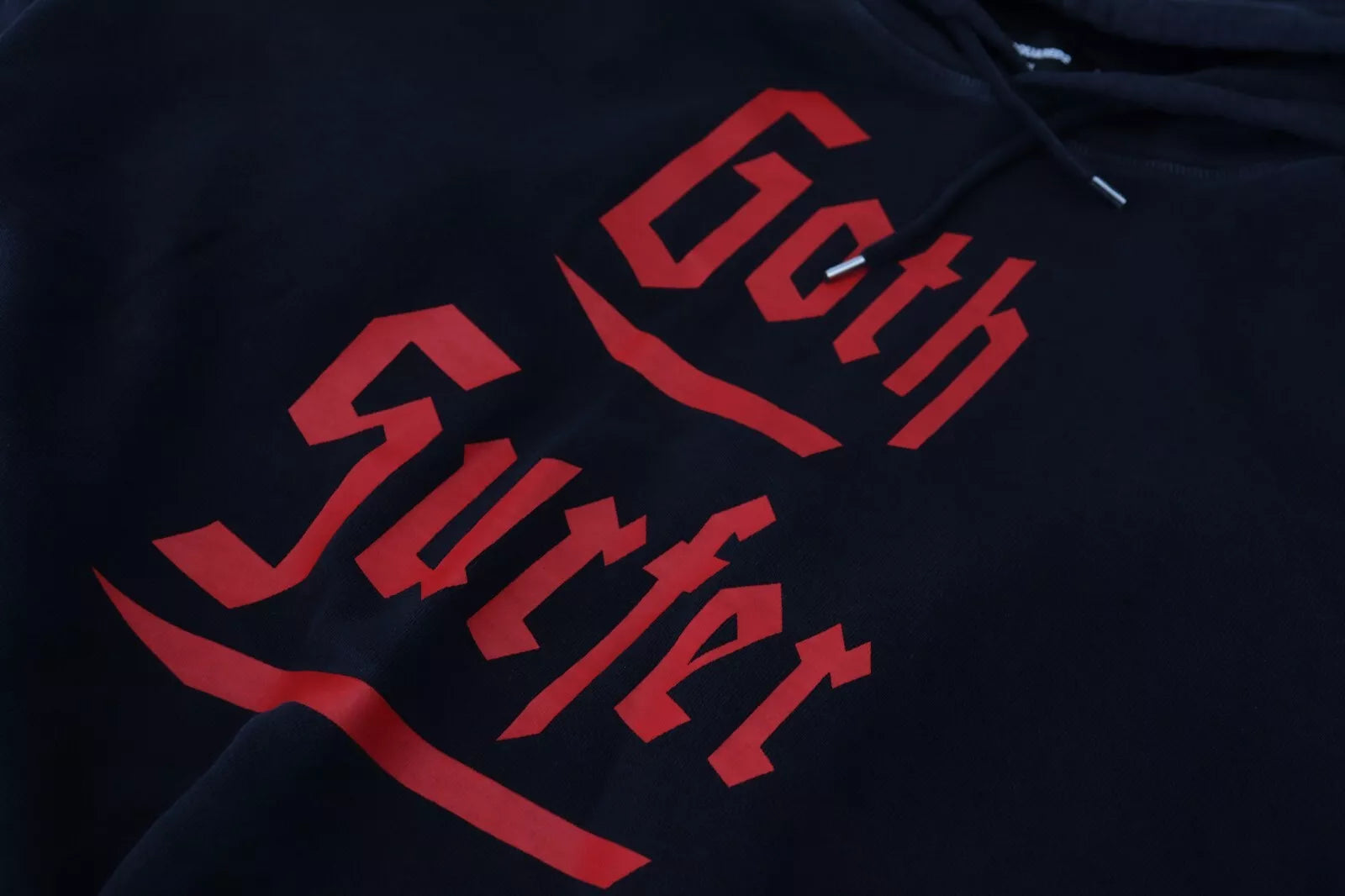 Black hoodie with red lettering