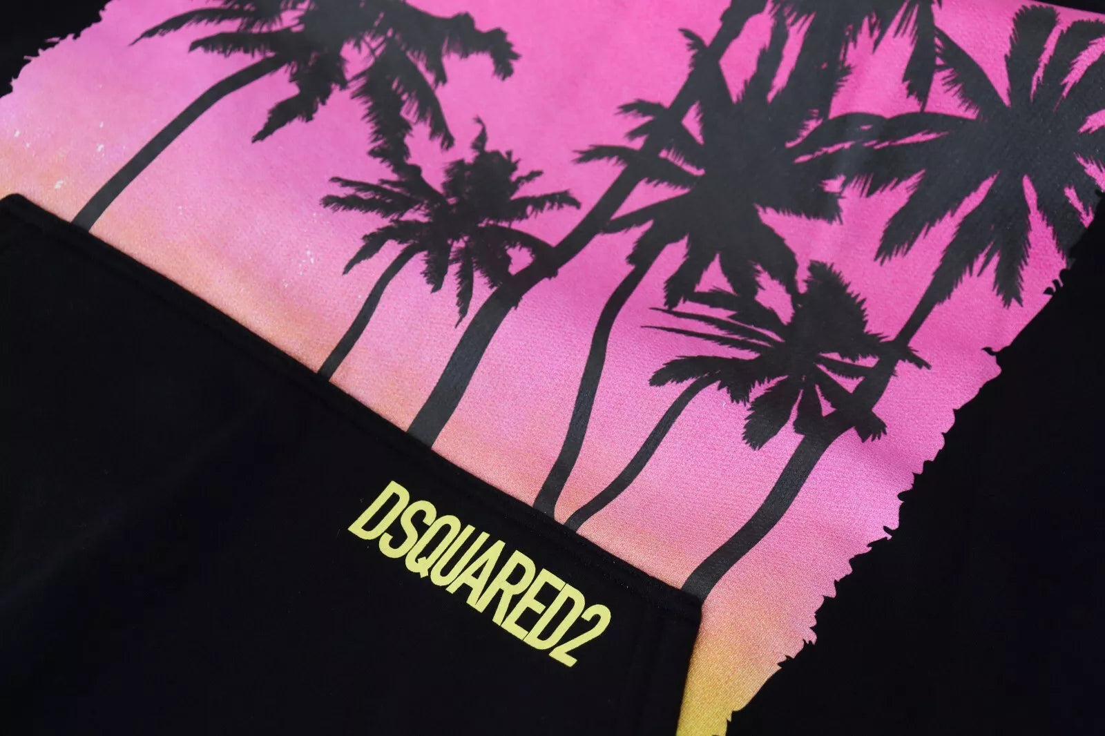 Pink and yellow graphic t-shirt with palm trees