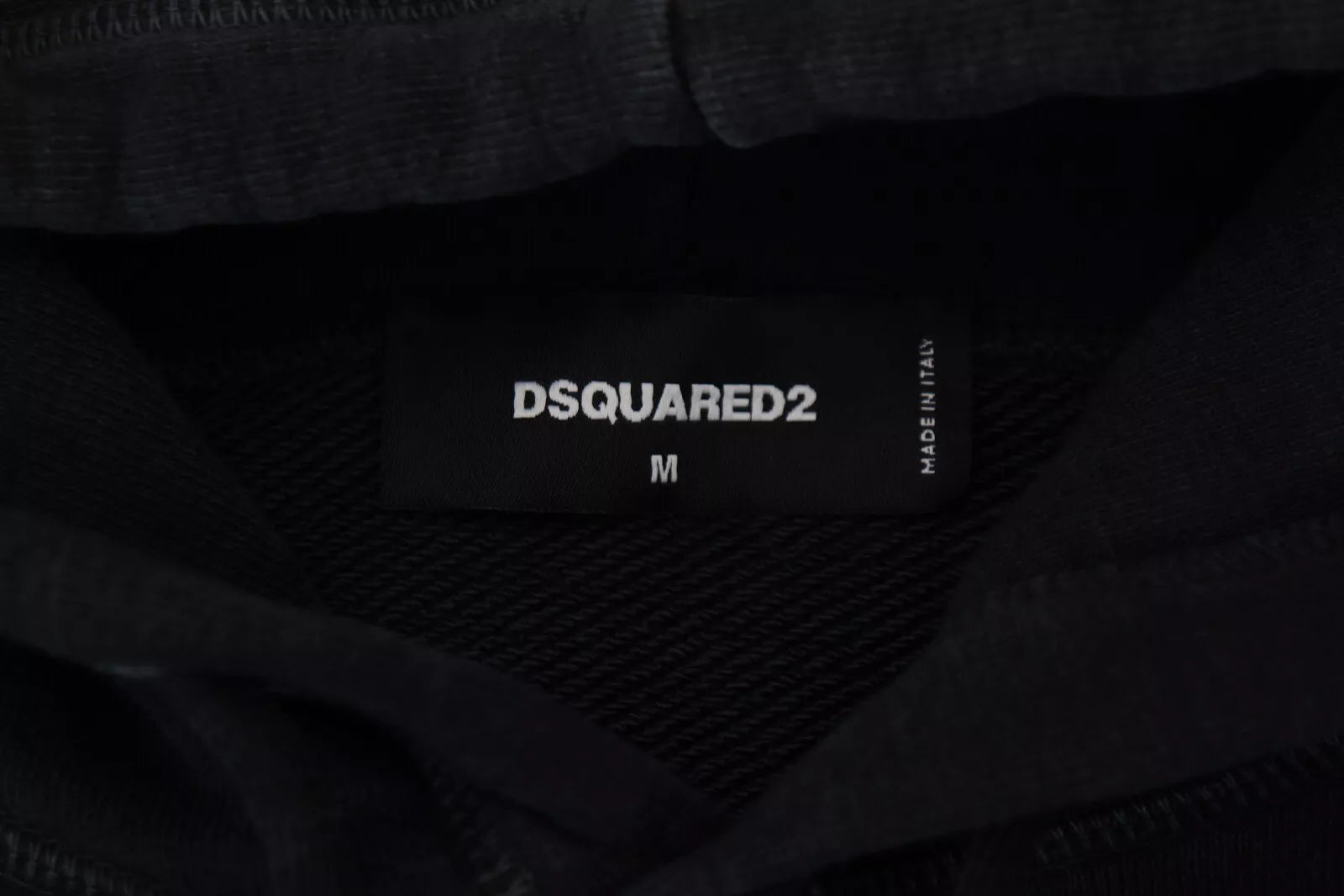 Black fabric with white label reading "DSQUARED2 M