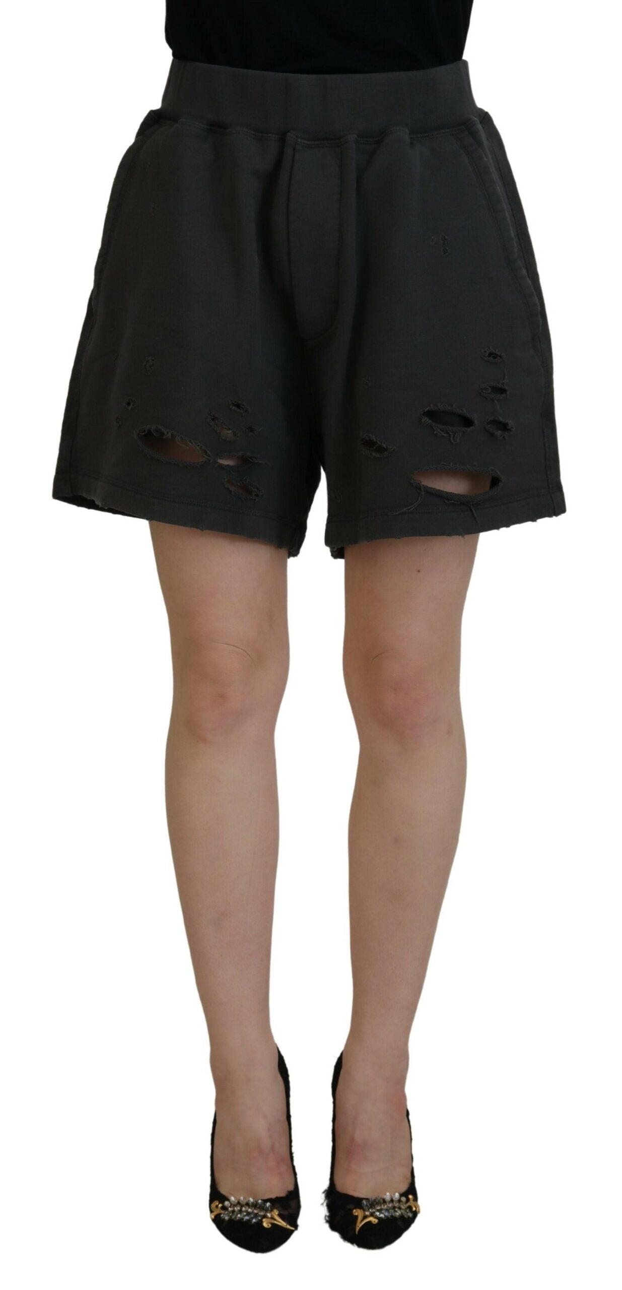 A pair of black tattered shorts with a mid waist
