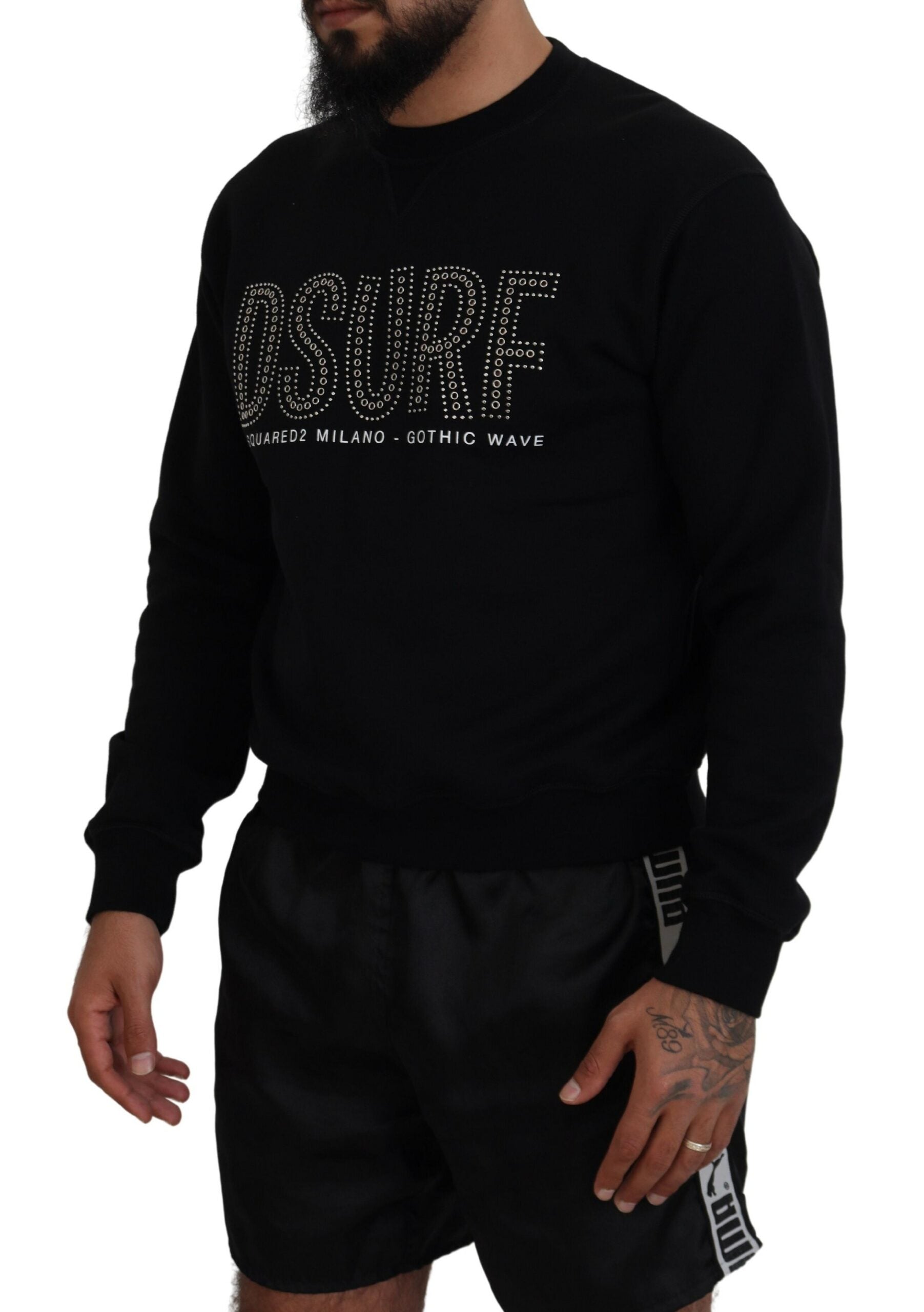 Man wearing black sweatshirt with white lettering and graphic design