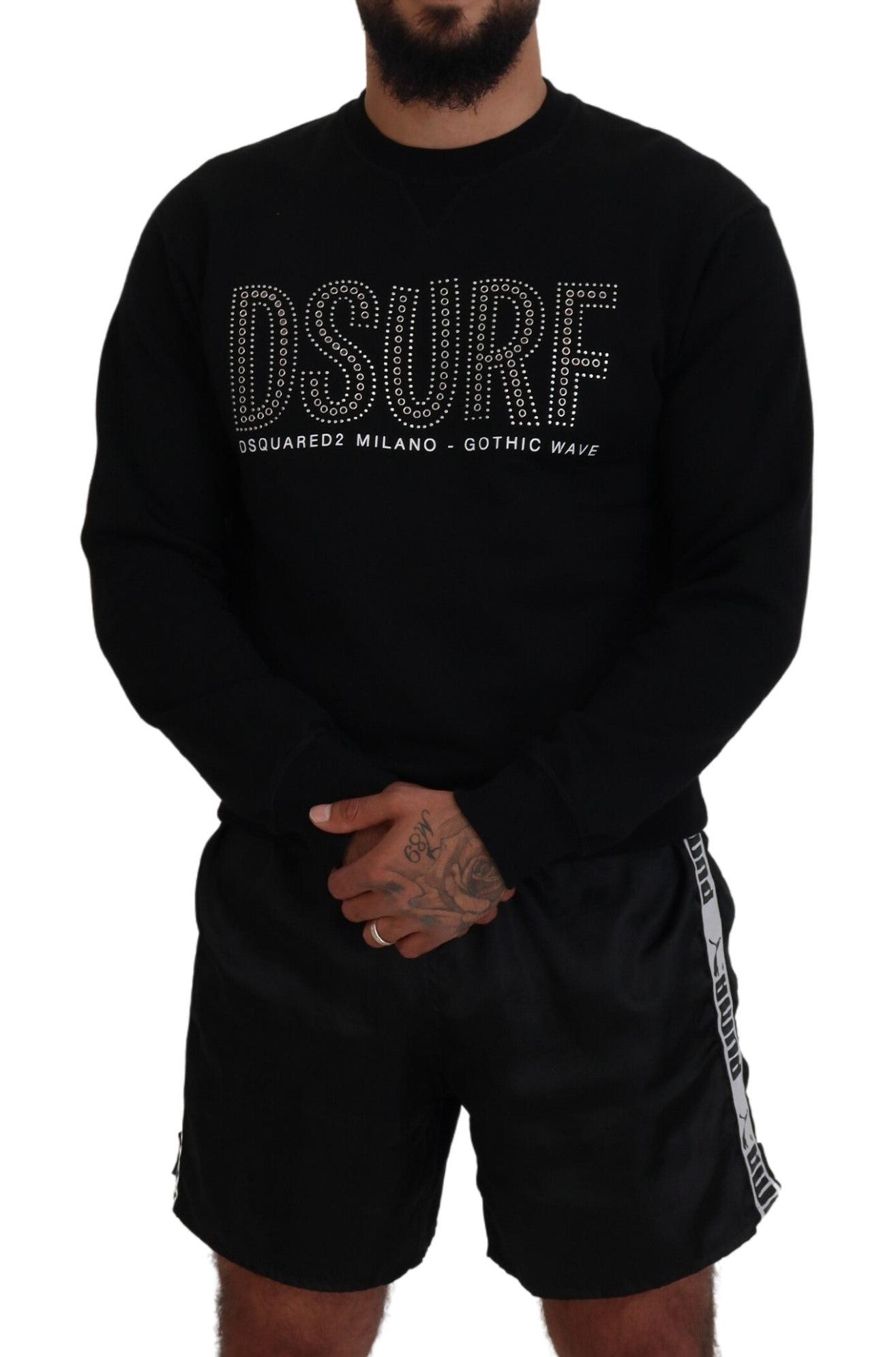 Man wearing black shirt and shorts