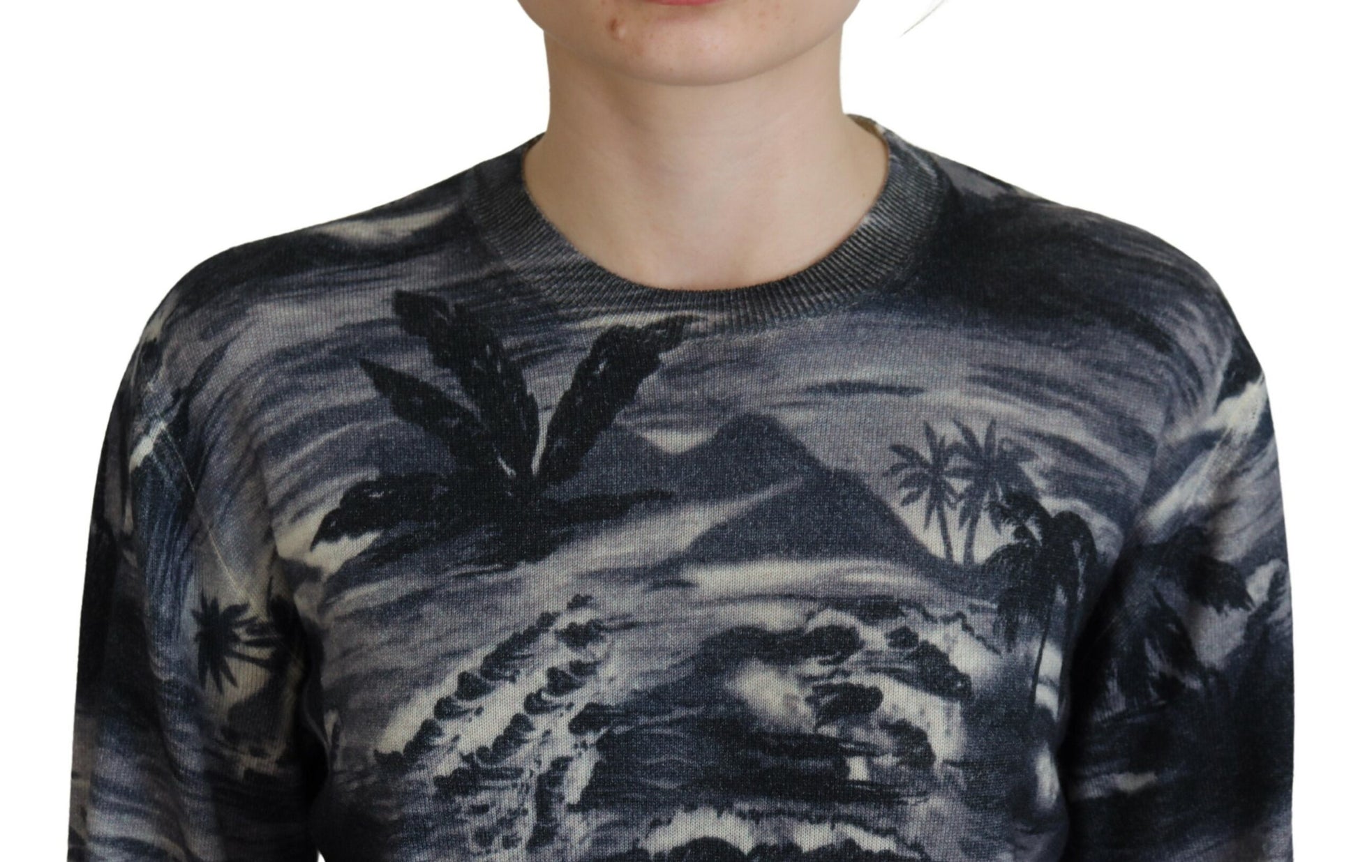 Man wearing a sweater with a mountain design