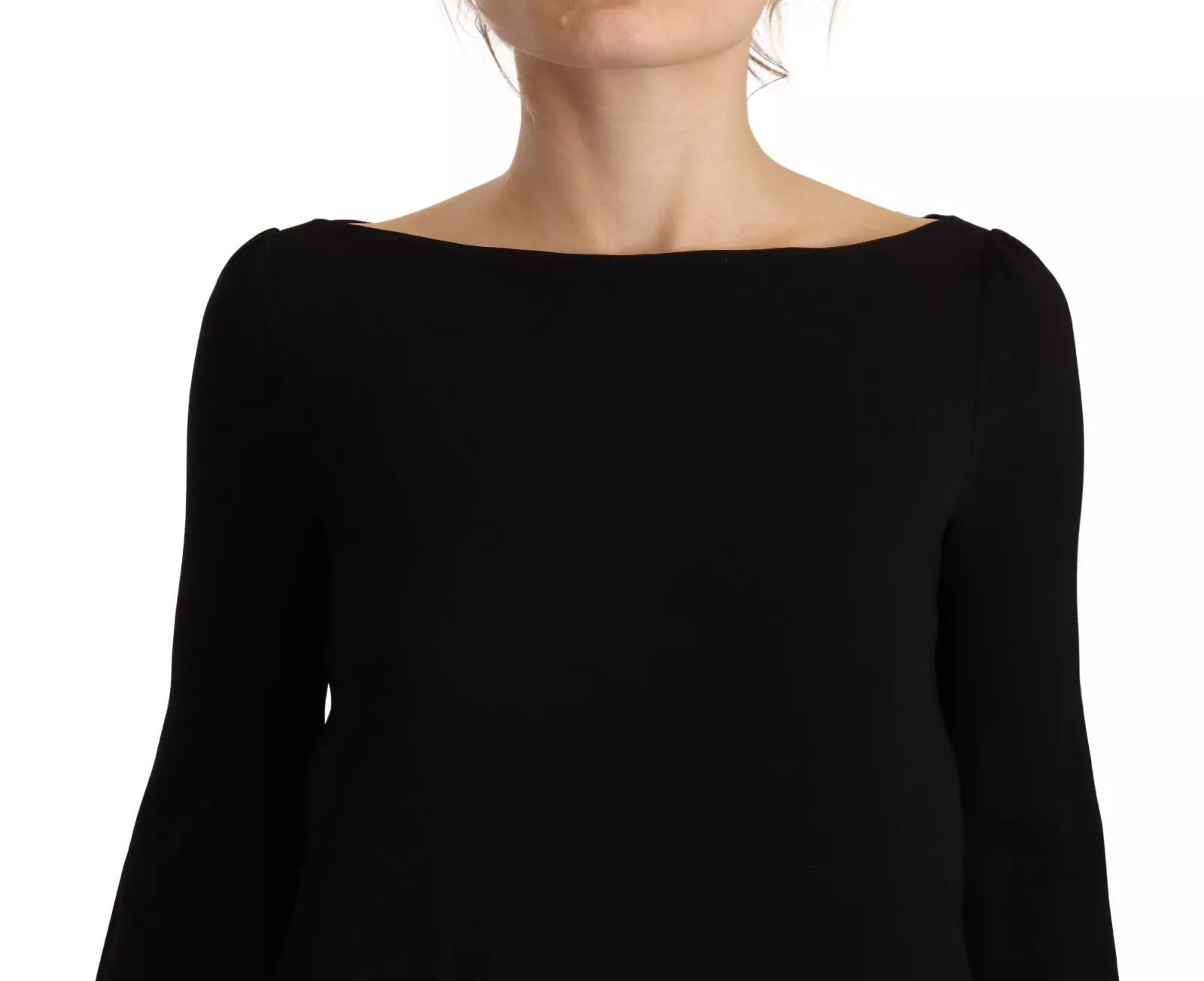 A black long sleeve dress with side slits and floor length