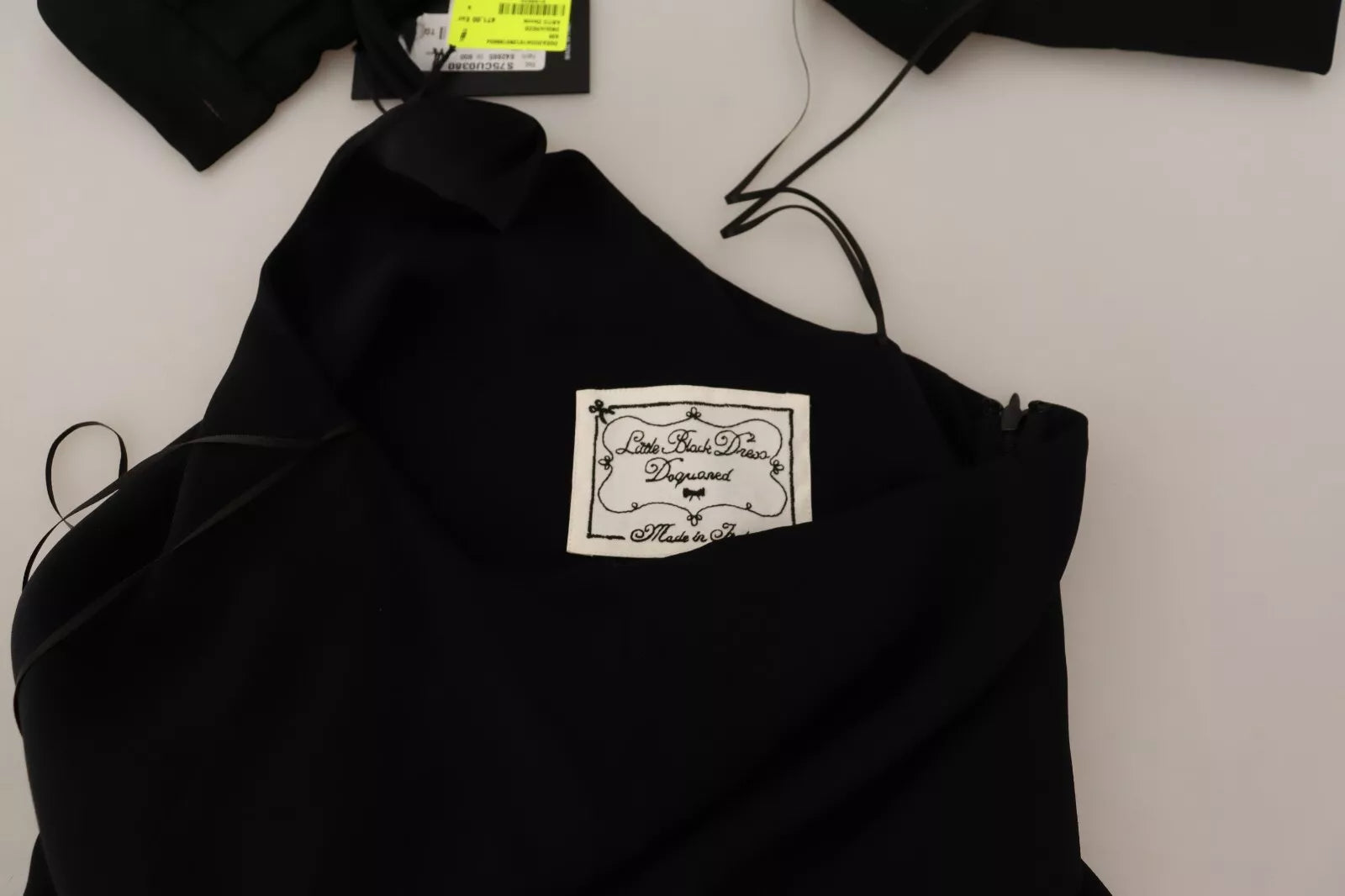 A black long sleeve dress with side slits and floor length design