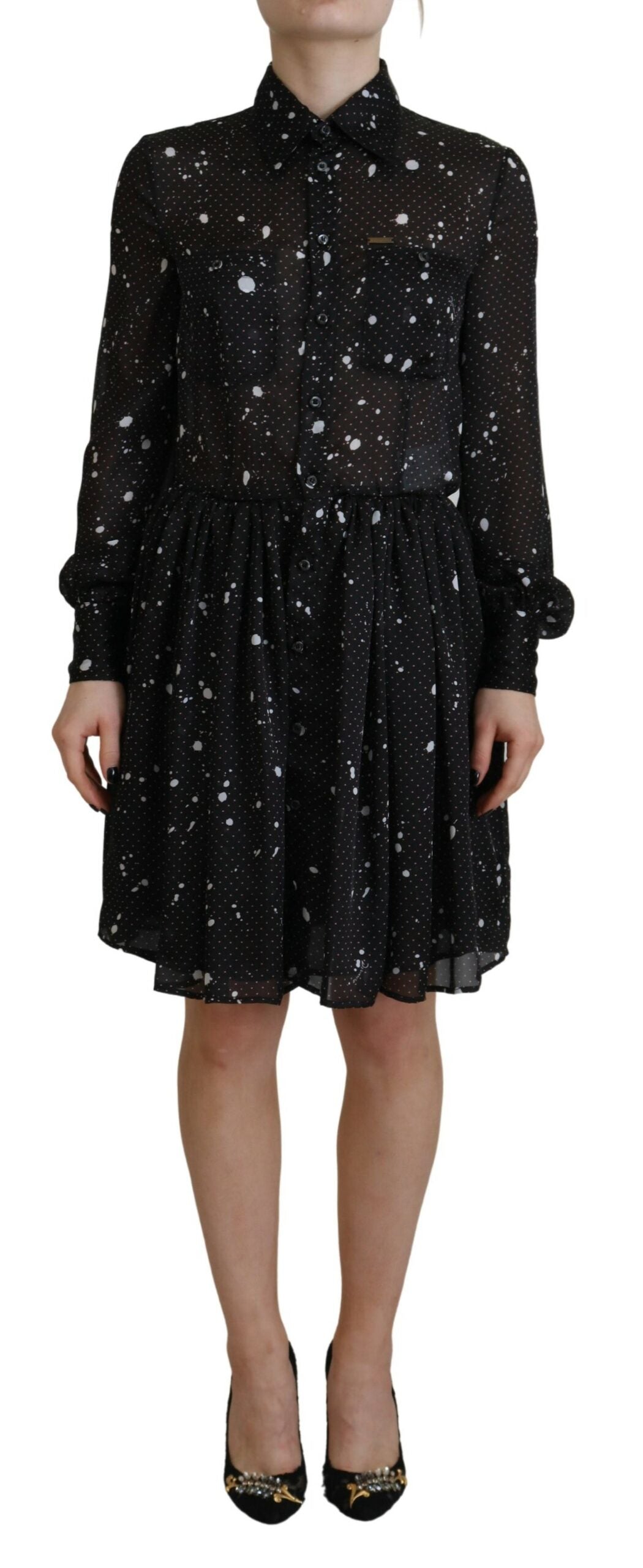 A black dress with polka dots on a white background