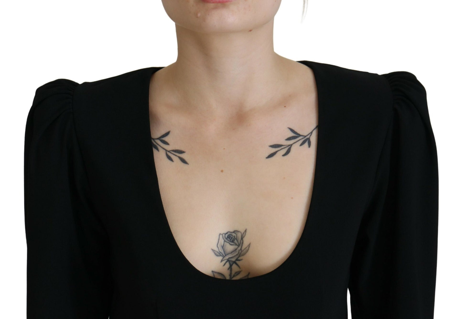A black bodycon sheath dress with long sleeves and a plunging neckline