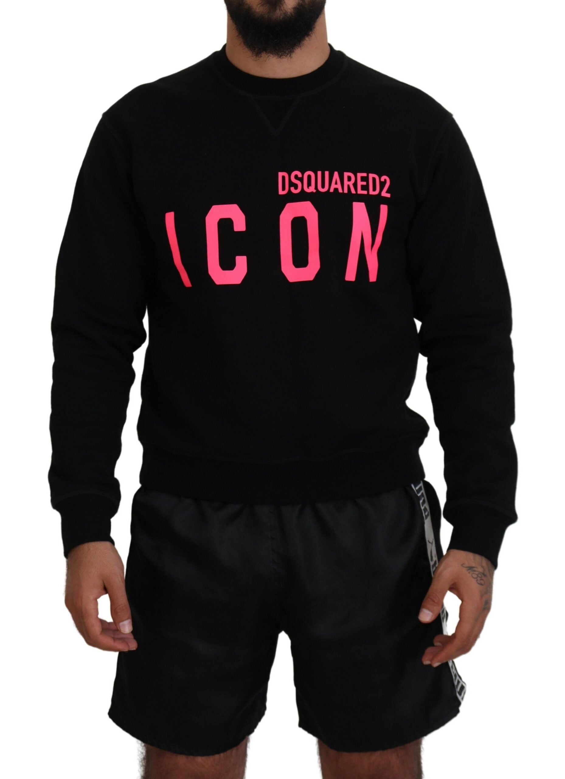 Man wearing black sweatshirt with pink lettering