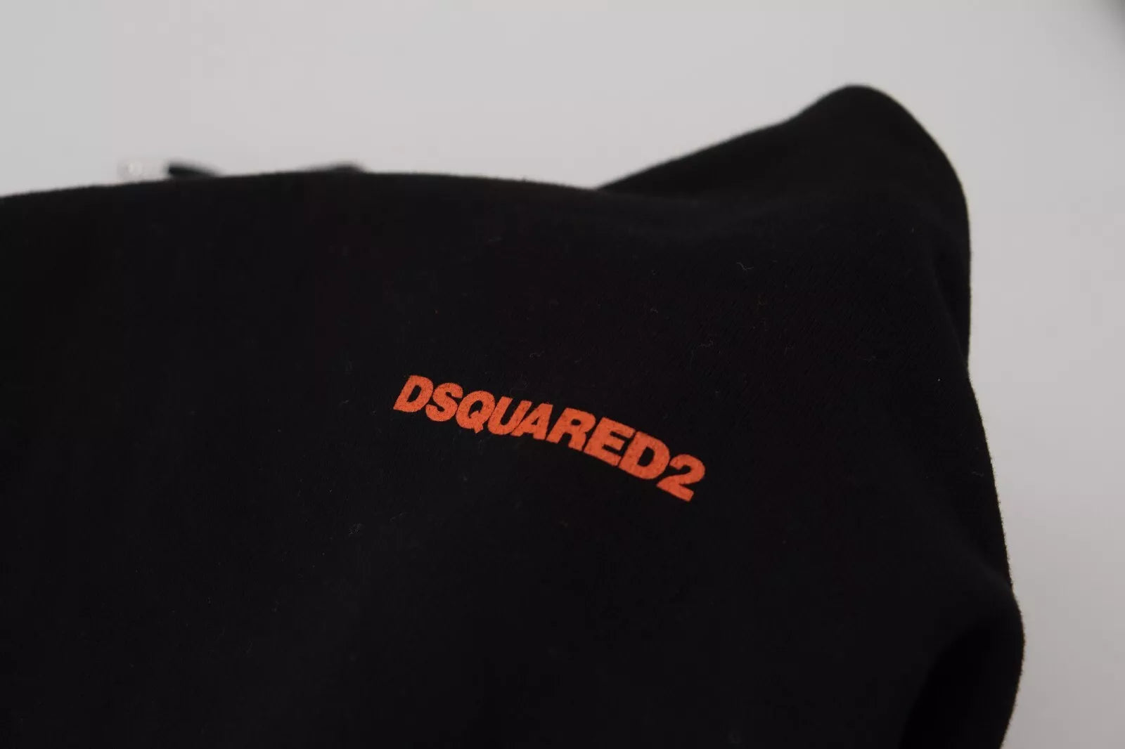 Black t-shirt with red logo on front