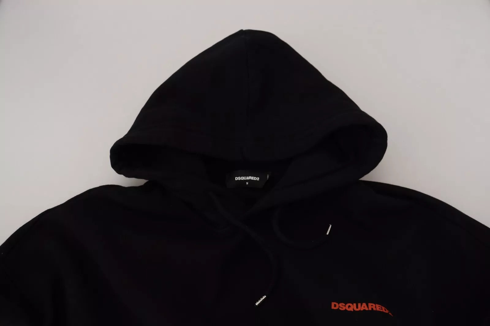 Black hoodie on white surface
