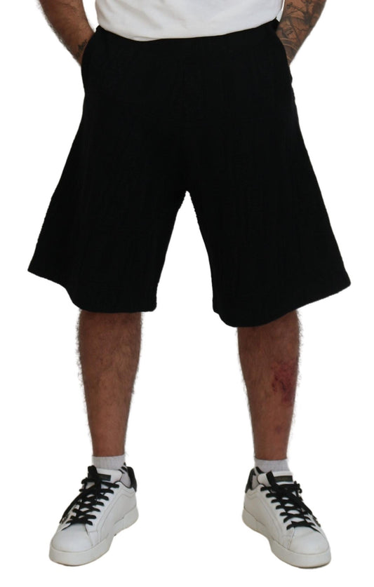 Man wearing black shorts and white sneakers