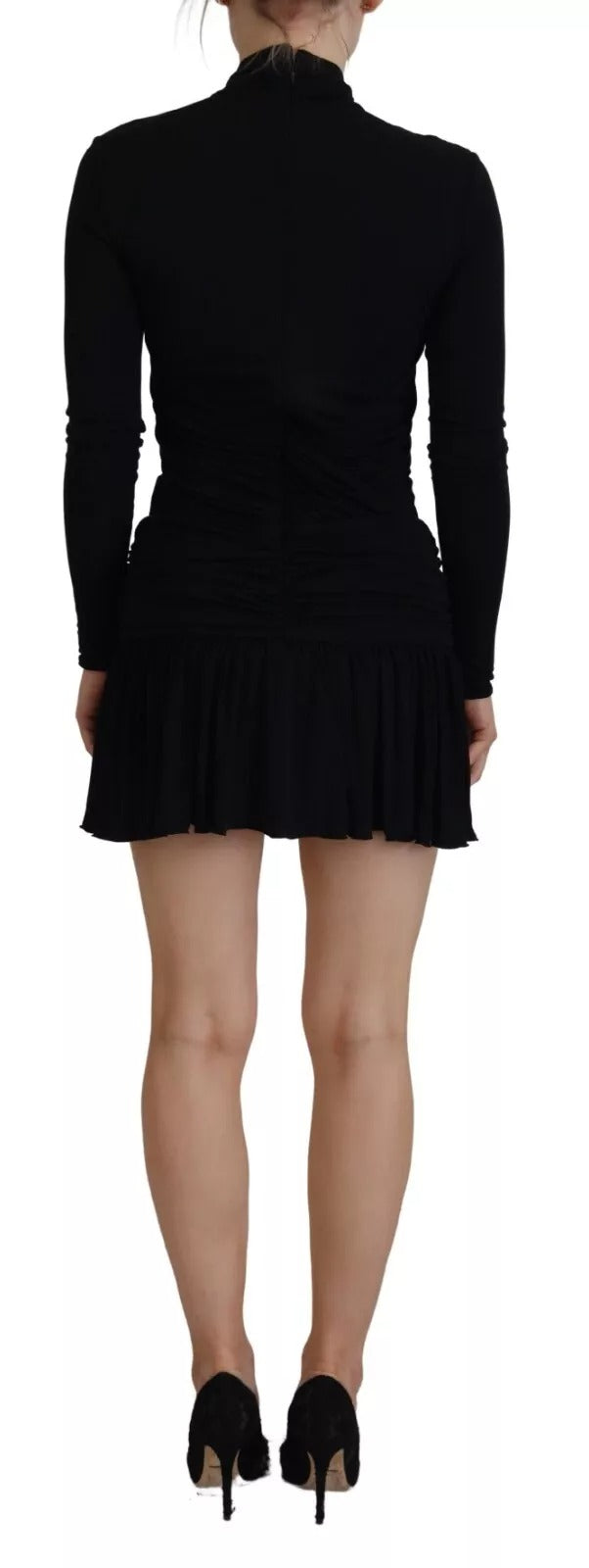 A black viscose long sleeve cut out mini dress with a high neckline