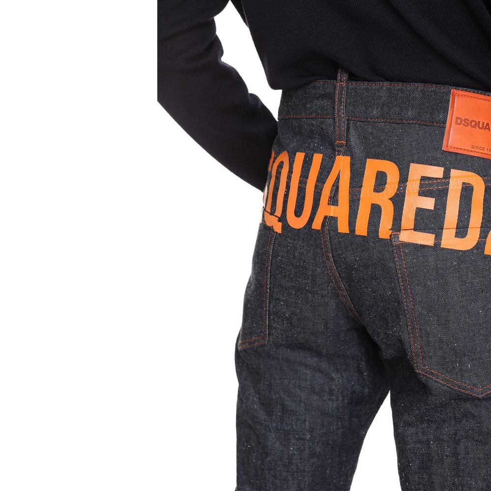Pair of blue jeans with orange lettering on back