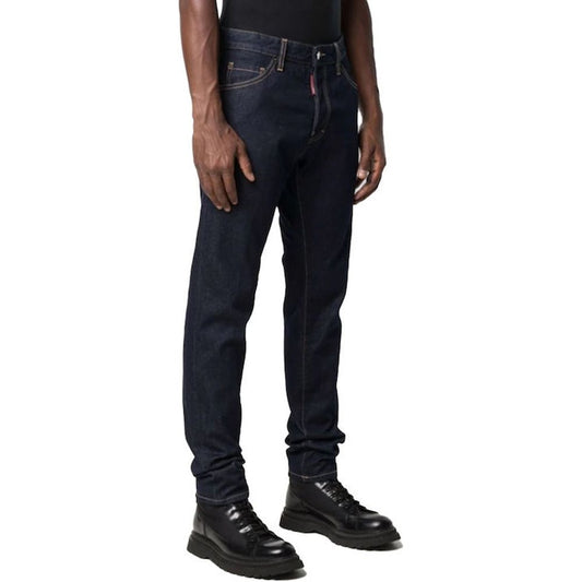 Man wearing blue jeans and black shoes