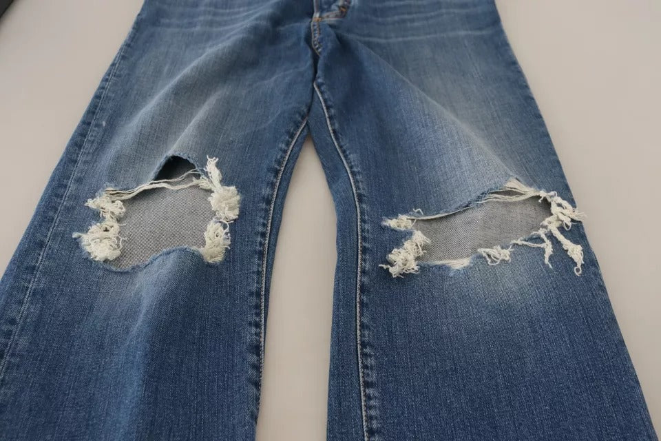Pair of blue jeans with holes in knees