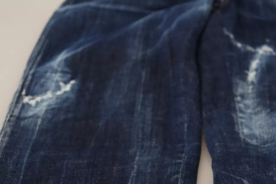 Pair of blue denim jeans with distressed areas