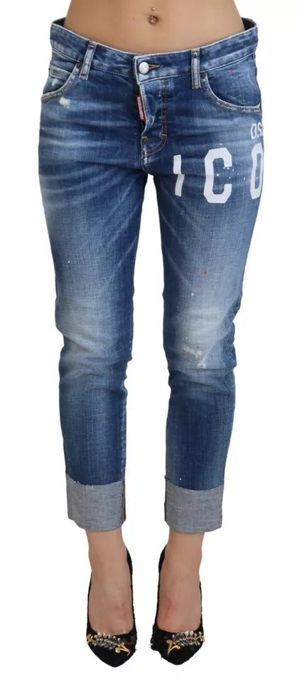 Pair of blue denim jeans with white lettering on legs