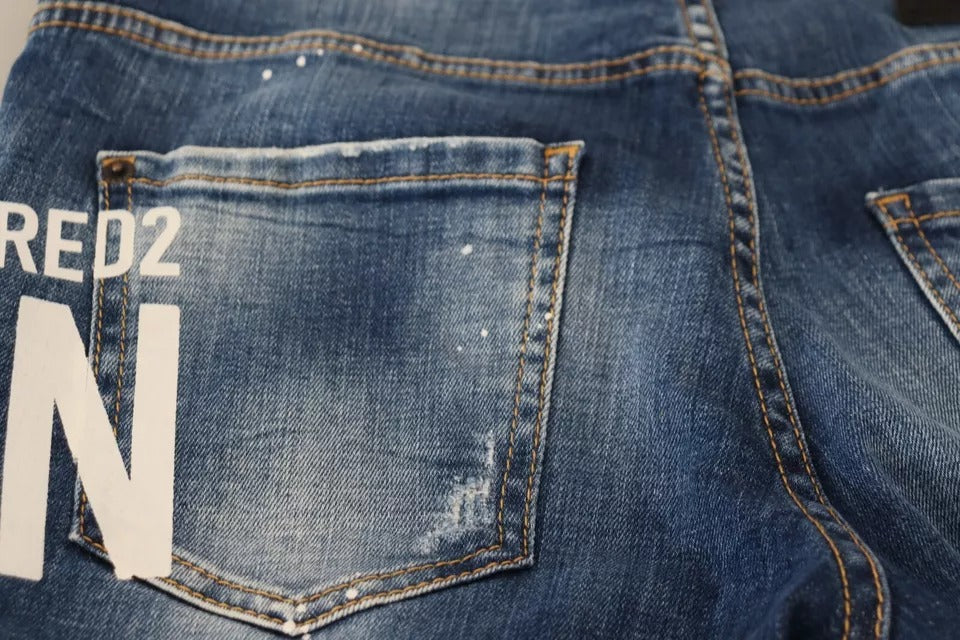 Blue denim jeans with white lettering on back pocket