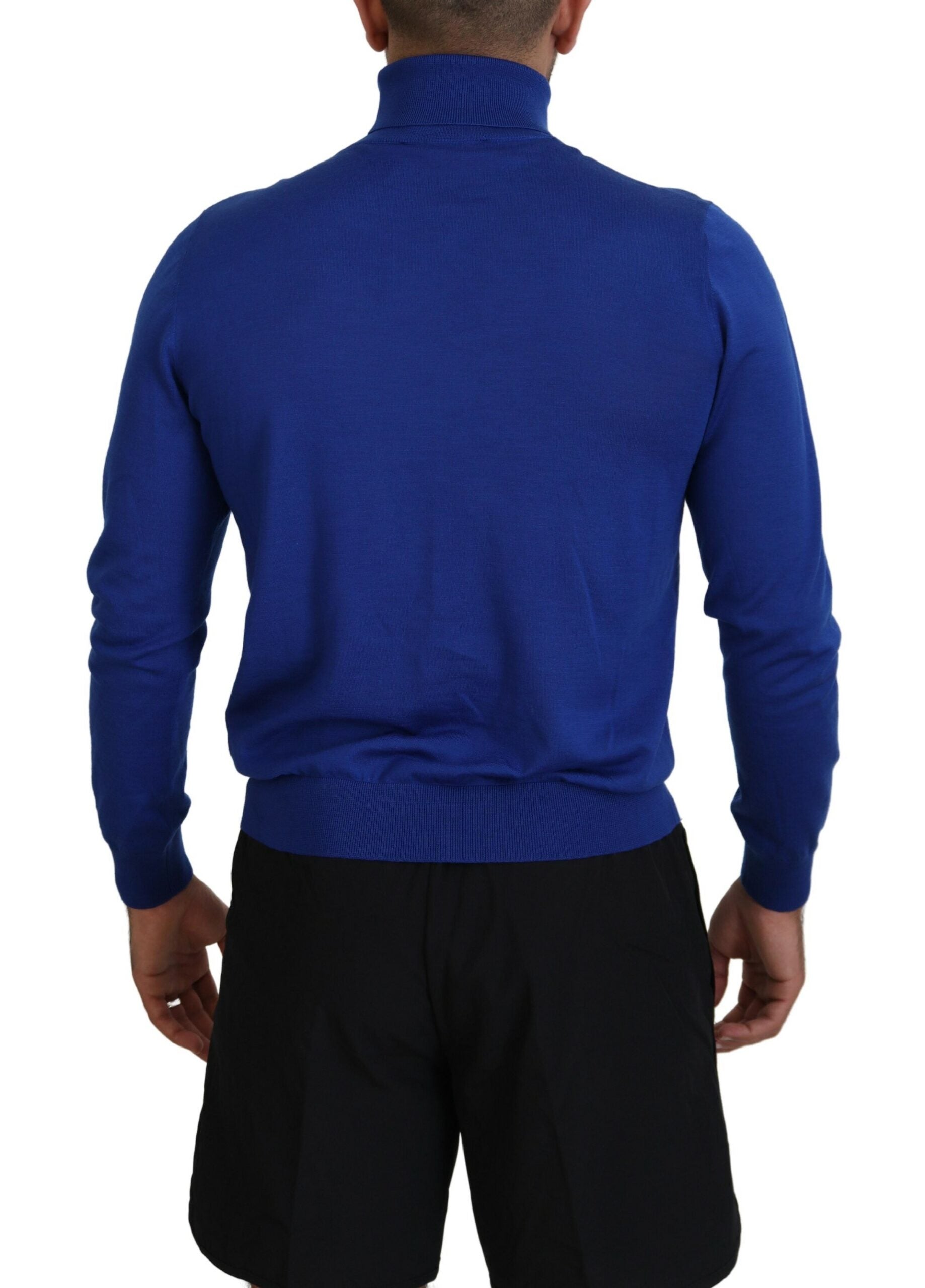 Blue sweater on man's back