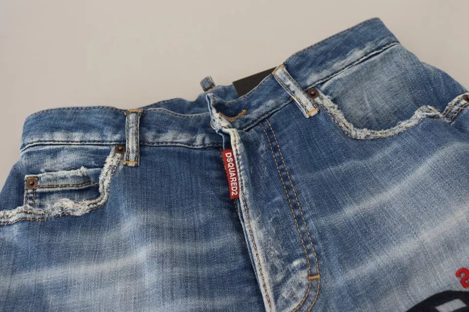 Blue denim jeans with distressed design