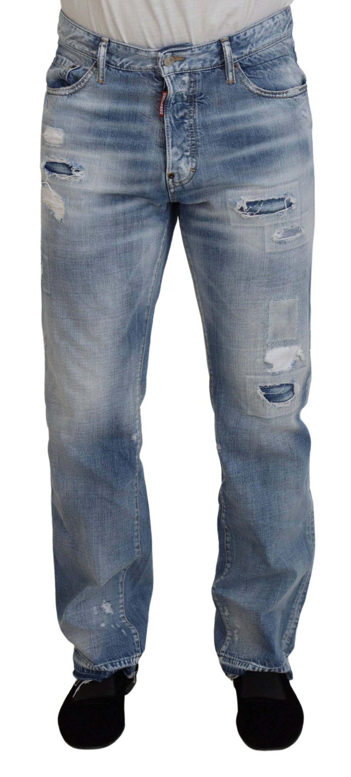 Pair of blue denim jeans with distressed areas