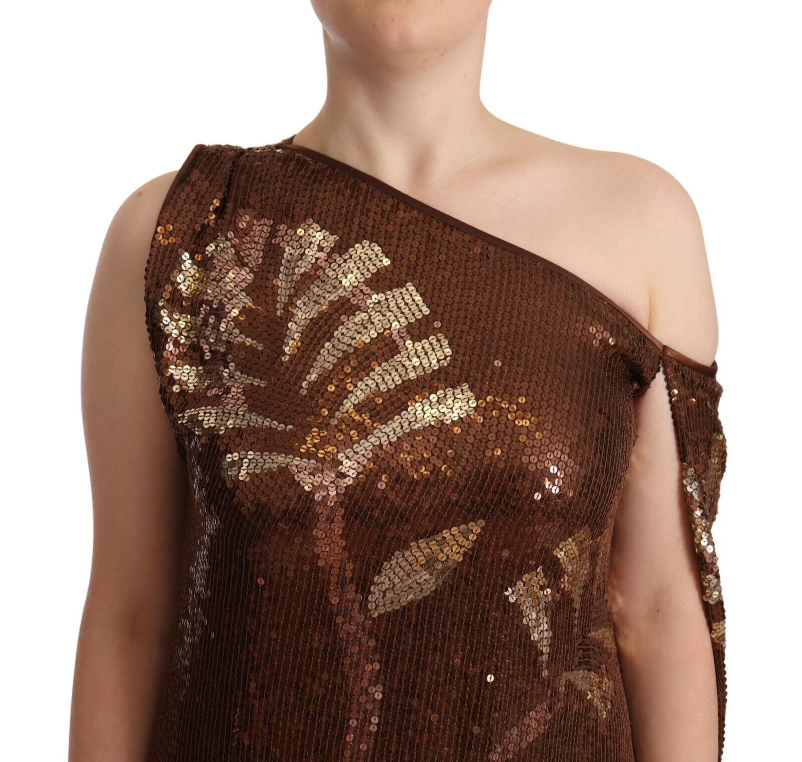 A brown sequined dress with a leaf pattern on one shoulder, worn by a mannequin
