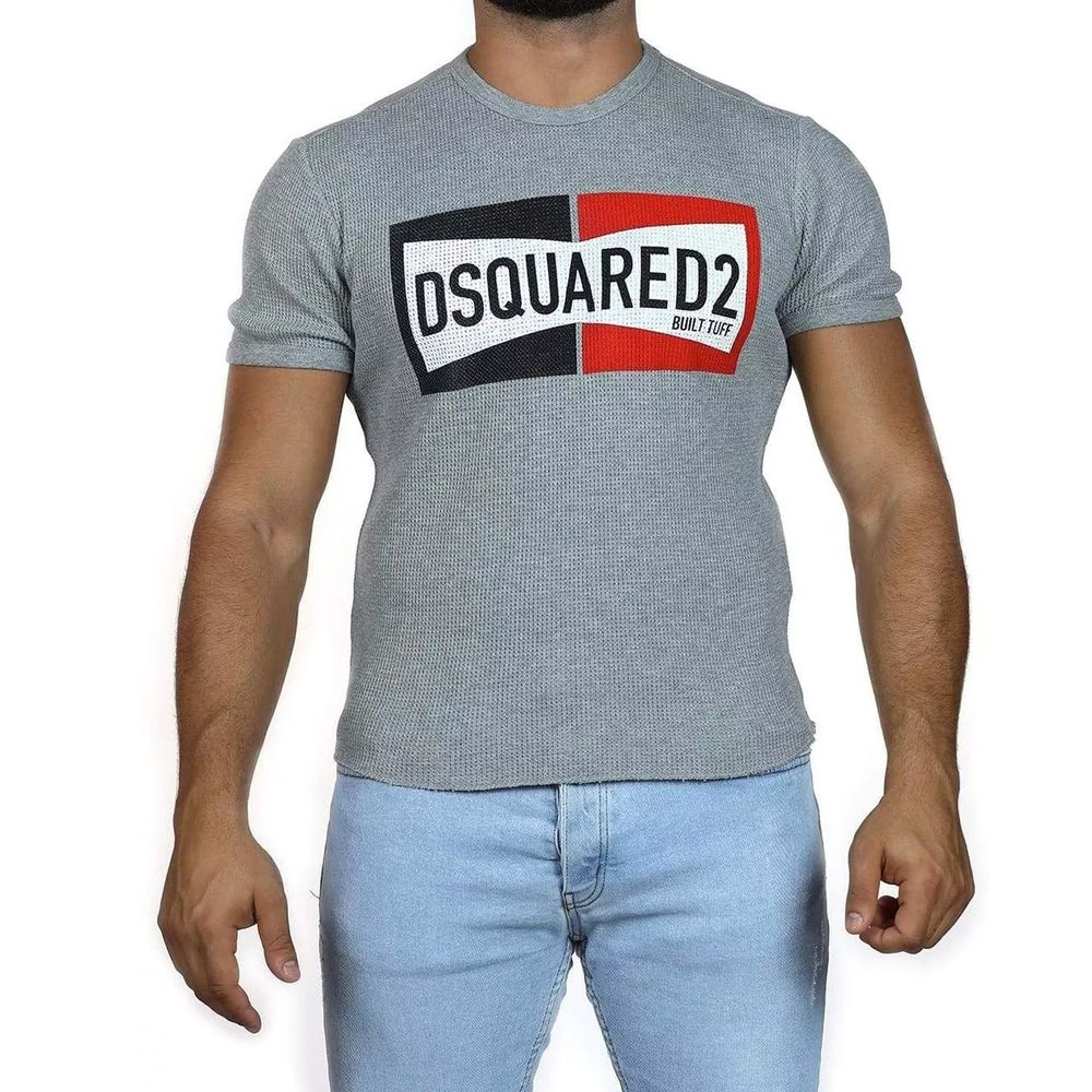 Man wearing gray t-shirt with red and blue logo