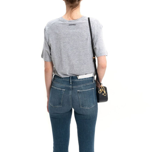 Woman wearing blue jeans and grey shirt